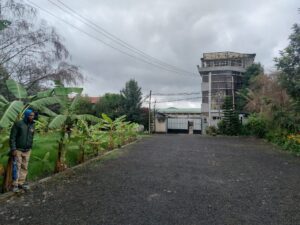 Large logistics yard at Imperial Trading Ltd featuring shipping containers and delivery vans for wholesale Ethiopian coffee UK.